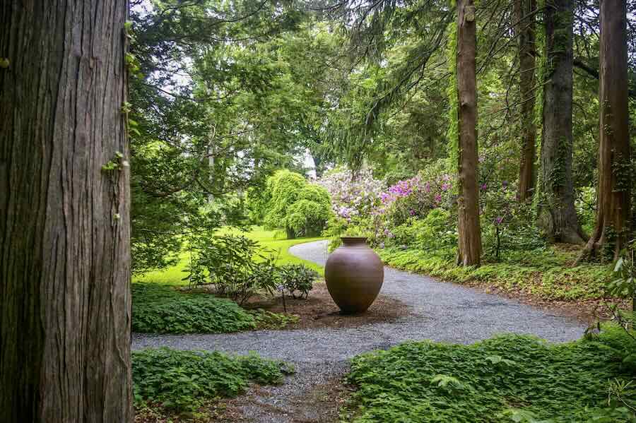 sculptural pots contained in the yard, with stephen procter